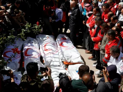 FILE PHOTO: Palestinians mourn medics, who came under Israeli fire while on a rescue mission, after their bodies were recovered, according to the Red Crescent, at Nasser hospital in Khan Younis in the southern Gaza Strip March 31, 2025. REUTERS/Hatem Khaled/File Photo