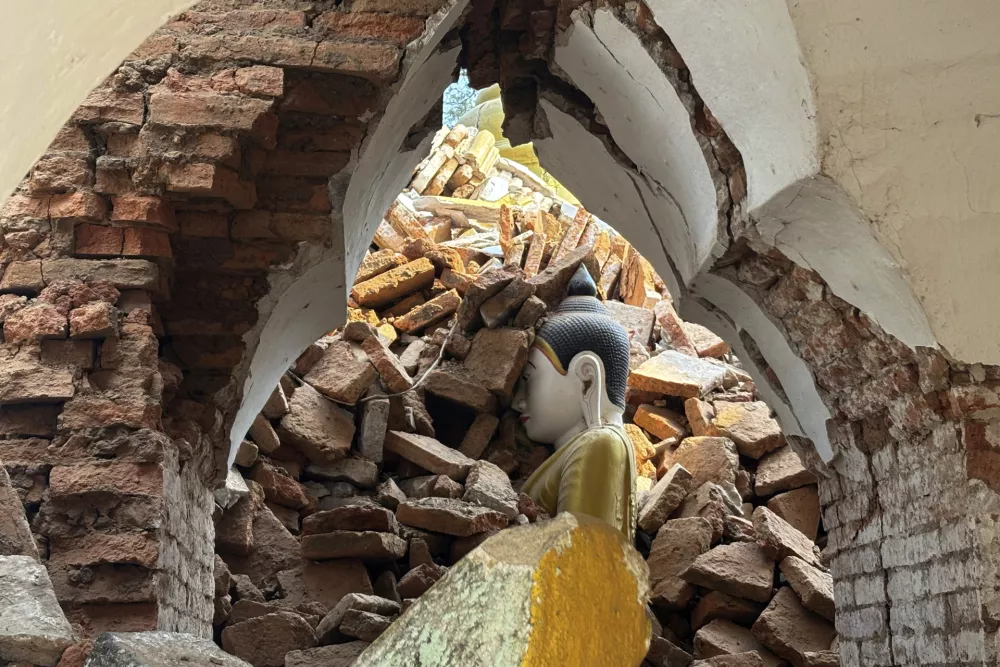 A damaged pagoda is partially buried in earthquake rubble in the Amarapura township, Mandalay, Myanmar, April 2, 2025. (AP Photo)
