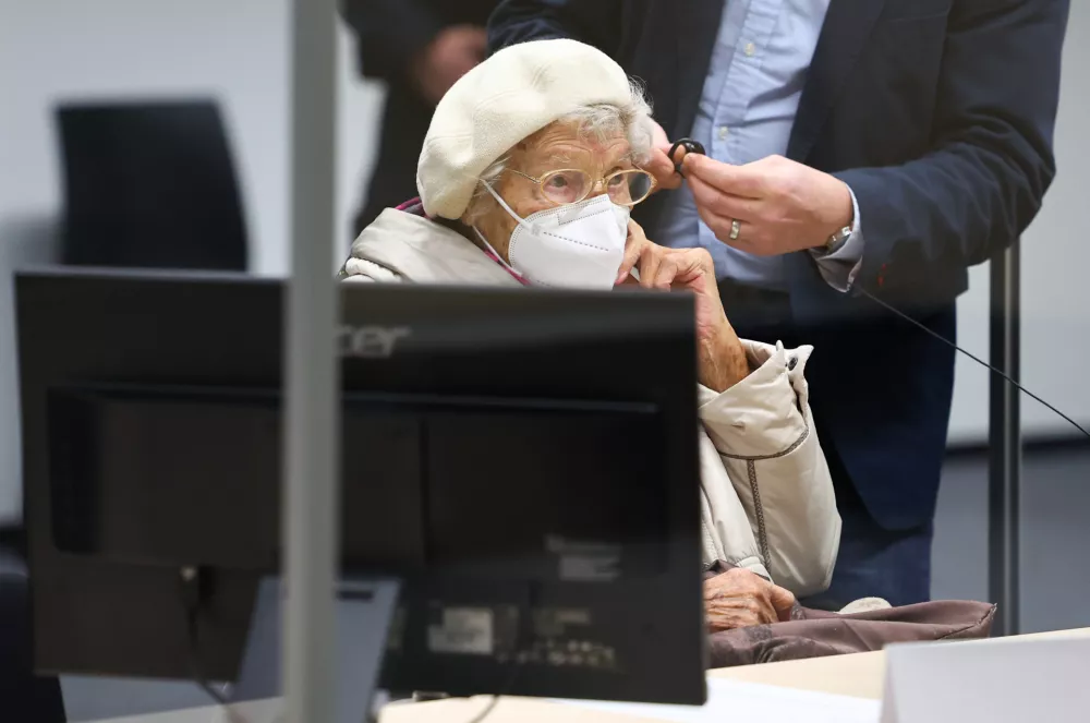FILED - 20 December 2022, Itzehoe: The defendant Irmgard F., charged with aiding mass murder in over 11,000 cases in the Stutthof concentration camp, sits in the courtroom at the beginning in Itzehoe. The 99-year-old former secretary at the Stutthof concentration camp convicted for aiding and abetting the mass murder of more than 10,000 people between June 1943 and April 1945 has died, prosecutors said on Monday. Photo: Christian Charisius/dpa