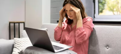 2H2GX51 Depressed Business Woman In Home Office With Headache