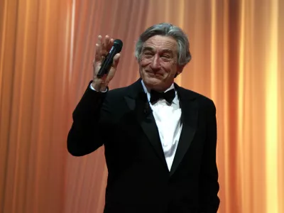 Jury president Robert De Niro gestures during the opening ceremony of the 64th Cannes Film Festival in Cannes May 11, 2011. Twenty films compete at the May 11 to 22 cinema showcase with an impressive roll call of major screen stars, revered "auteur" directors and relative newcomers. REUTERS/Eric Gaillard (FRANCE - Tags: ENTERTAINMENT)