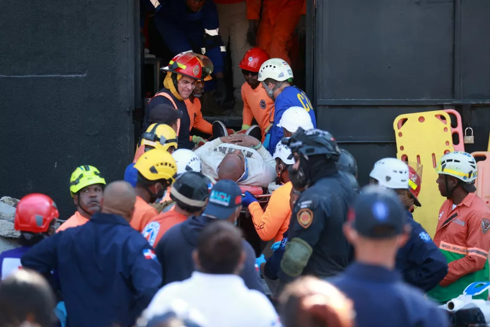 Rescuers work at the site of the collapsed Jet Set nightclub in Santo Domingo, Dominican Republic, April 8, 2025. REUTERS/Erika Santelices