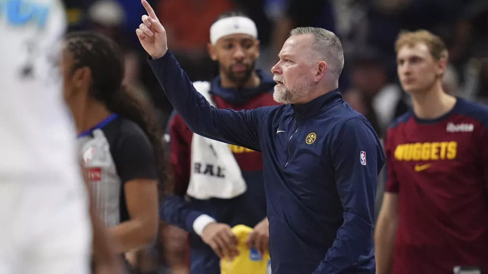 Denver Nuggets head coach Michael Malone directs his team against the Indiana Pacers in the second half of an NBA basketball game Sunday, April 6, 2025, in Denver. (AP Photo/David Zalubowski)