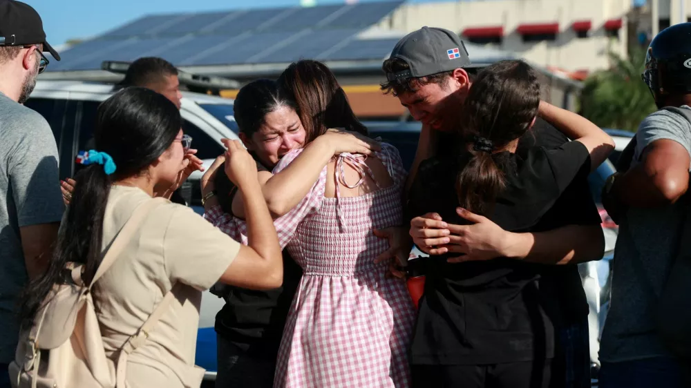 People react at the site where the roof of the Jet Set nightclub collapsed, in Santo Domingo, Dominican Republic, April 8, 2025. REUTERS/Erika Santelices   TPX IMAGES OF THE DAY