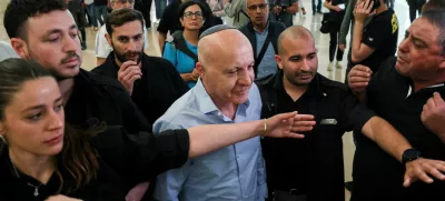Former head of Israel's Shin Bet domestic intelligence service Yoram Cohen is guarded by the court security personnel, as he walks out from the courtroom during a hearing on the government's dismissal of the head of the Shin Bet domestic intelligence service, Ronen Bar, at the high court in Jerusalem April 8, 2025. REUTERS/Ronen Zvulun
