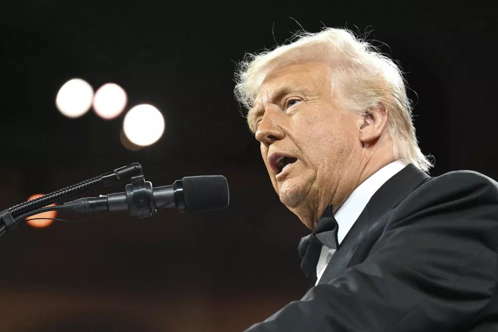 President Donald Trump speaks at the National Republican Congressional Committee (NRCC) dinner at the National Building Museum in Washington, Tuesday, April 8, 2025. (Pool via AP)