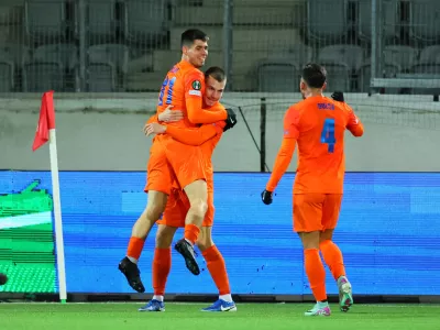 Soccer Football - Conference League - Round of 16 - Second Leg - Lugano v Celje - Stockhorn Arena, Thun, Switzerland - March 13, 2025 Celje's Svit Seslar celebrates scoring their first goal with teammates REUTERS/Denis Balibouse