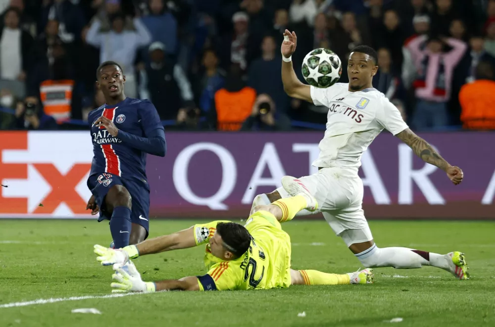 Soccer Football - Champions League - Quarter Final - First Leg - Paris St Germain v Aston Villa - Parc des Princes, Paris, France - April 9, 2025 Paris St Germain's Nuno Mendes scores their third goal REUTERS/Stephanie Lecocq