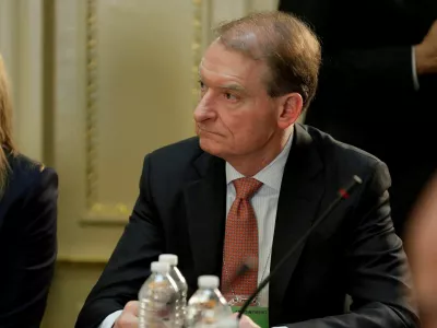 FILE PHOTO: CEO of Patomak Global Partners Paul Atkins takes part in a strategic and policy CEO discussion with U.S. President Donald Trump in the Eisenhower Execution Office Building in Washington, U.S., April 11, 2017. REUTERS/Joshua Roberts/File Photo