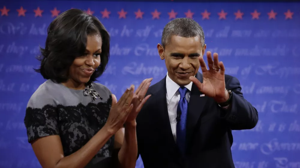 President Barack Obama and Michelle wave to members of the audience following the third presidential debate with Republican presidential nominee Mitt Romney at Lynn University, Monday, Oct. 22, 2012, in Boca Raton, Fla. (AP Photo/David Goldman)