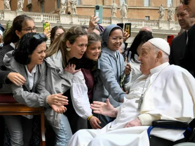 Pope Francis meets with people as he unexpectedly appears during the Palm Sunday Mass in Saint Peter's Square at the Vatican, April 13, 2024.  Vatican Media/­Handout via REUTERS  ATTENTION EDITORS - THIS IMAGE WAS PROVIDED BY A THIRD PARTY.