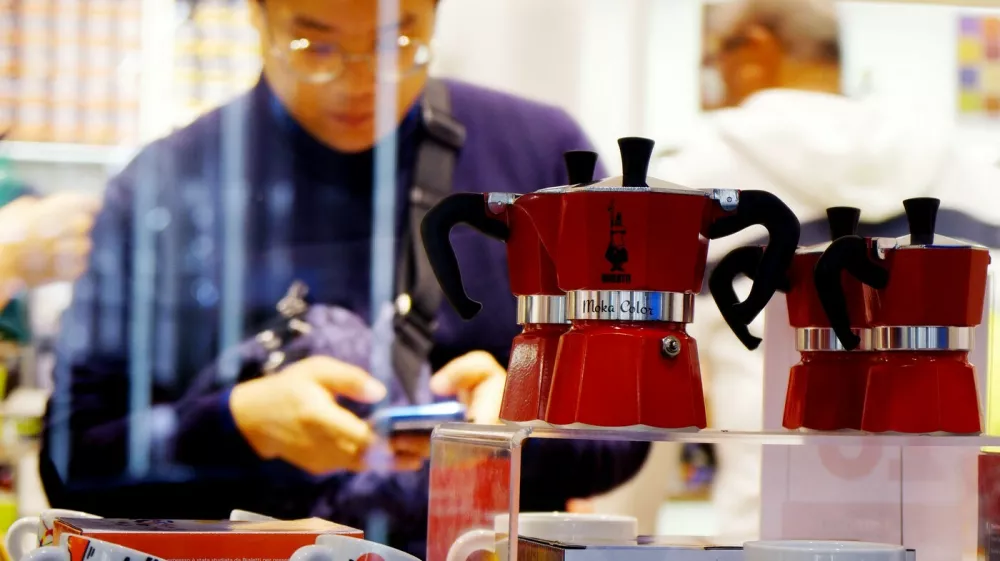 Models of Italy's iconic stove-top Moka coffee maker, Bialetti, are pictured in a store in Rome on October 31, 2018 as the brand has sought protection from creditors while it negotiates an injection of funds to shift to growth products including capsule systems. The octagonal metal pot that sends steam up through ground coffee became a paragon of Italian design as well as the preferred method for generations of Italians to make their morning expresso. While an updated model remains popular, sales slumped 12 percent in the first half of the year due to shifts in the market and financial difficulties that led to supply problems. Bialetti racked up a net loss of 15.3 million euros ($17.2 million).,Image: 393532846, License: Rights-managed, Restrictions: TO GO WITH AFP STORY MADE BY CELINE CORNU, Model Release: no