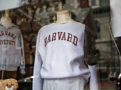 Harvard sweatshirts are displayed for sale in a school store window on the Harvard University campus in Cambridge, Massachussetts, on April 15, 2025. Elite US university Harvard was hit with a .2 billion federal funding freeze on April 14 after rejecting a list of sweeping demands that the White House said was intended to crack down on campus anti-Semitism. The call for changes to its governance, hiring practices and admissions procedures expands a list Harvard received on April 3, which ordered officials to shut diversity offices and cooperate with immigration authorities for screenings of international students. In a letter to students and faculty, Harvard president Alan Garber vowed to defy the government, insisting that the school would not "negotiate over its independence or its constitutional rights.",Image: 988277045, License: Rights-managed, Restrictions:, Model Release: no