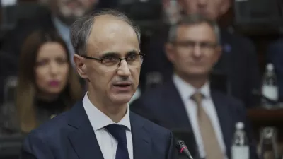 Serbia's Prime Minister designate Djuro Macut presents a plan for the new government to parliament members in Belgrade, Serbia, Tuesday, April 15, 2025. (AP Photo/Darko Vojinovic)