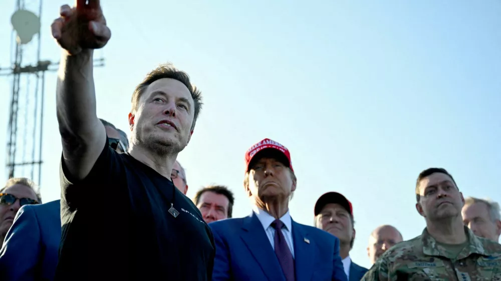 FILE PHOTO: Elon Musk speaks with U.S. President-elect Donald Trump and guests at a viewing of the launch of the sixth test flight of the SpaceX Starship, in Brownsville, Texas, U.S., November 19, 2024. Brandon Bell/Pool via REUTERS/File Photo
