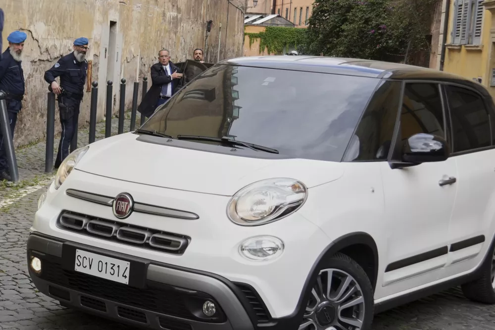 A car with Pope Francis enters the Regina Coeli penitentiary in Rome on Holy Thursday, Thursday, April 17, 2025. (AP Photo/Andrew Medichini)