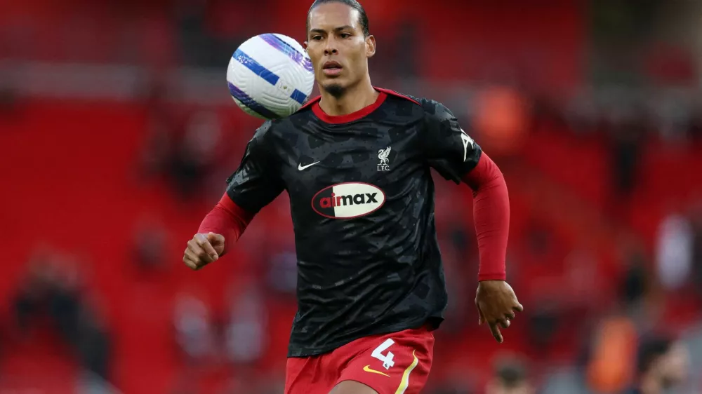 FILE PHOTO: Soccer Football - Premier League - Liverpool v Everton - Anfield, Liverpool, Britain - April 2, 2025 Liverpool's Virgil van Dijk during the warm up before the match REUTERS/Phil Noble EDITORIAL USE ONLY. NO USE WITH UNAUTHORIZED AUDIO, VIDEO, DATA, FIXTURE LISTS, CLUB/LEAGUE LOGOS OR 'LIVE' SERVICES. ONLINE IN-MATCH USE LIMITED TO 120 IMAGES, NO VIDEO EMULATION. NO USE IN BETTING, GAMES OR SINGLE CLUB/LEAGUE/PLAYER PUBLICATIONS. PLEASE CONTACT YOUR ACCOUNT REPRESENTATIVE FOR FURTHER DETAILS../File Photo
