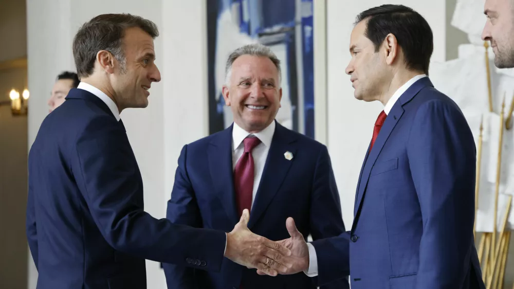 French President Emmanuel Macron, left, welcomes US Special Envoy Steve Witkoff, center, and US Secretary of State Marco Rubio for a meeting at the Elysee Palace in Paris, Thursday April 17, 2025. (Ludovic Marin, Pool Photo via AP)