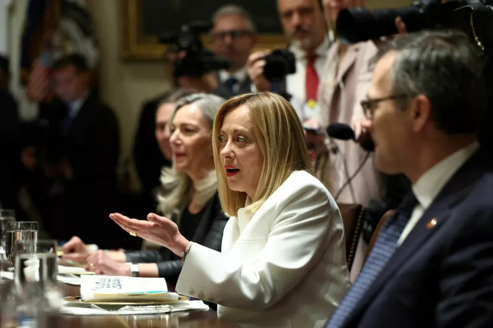 Italian Prime Minister Giorgia Meloni meets with U.S. President Donald Trump in the Cabinet Room at the White House in Washington, D.C., U.S., April 17, 2025. REUTERS/Evelyn Hockstein