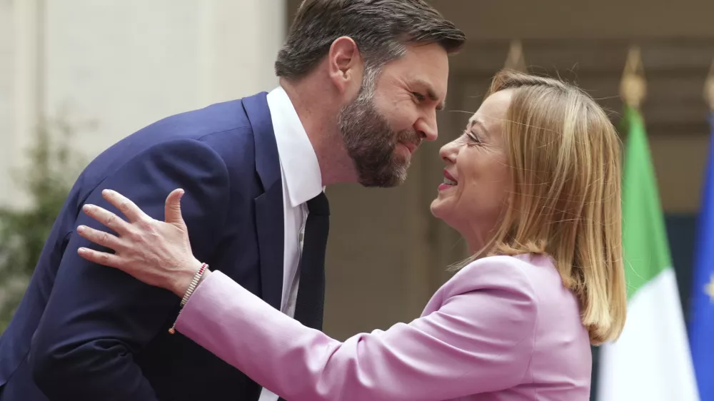 U.S. Vice President JD Vance, left, is welcomed by Italian Premier Giorgia Meloni as he arrives for talks at Palazzo Chigi government office in Rome, Friday, April 18, 2025. (AP Photo/Andrew Medichini)