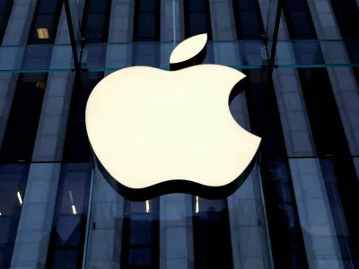 FILE PHOTO: The Apple Inc. logo is seen hanging at the entrance to the Apple store on 5th Avenue in Manhattan, New York, U.S., October 16, 2019. REUTERS/Mike Segar/File Photo