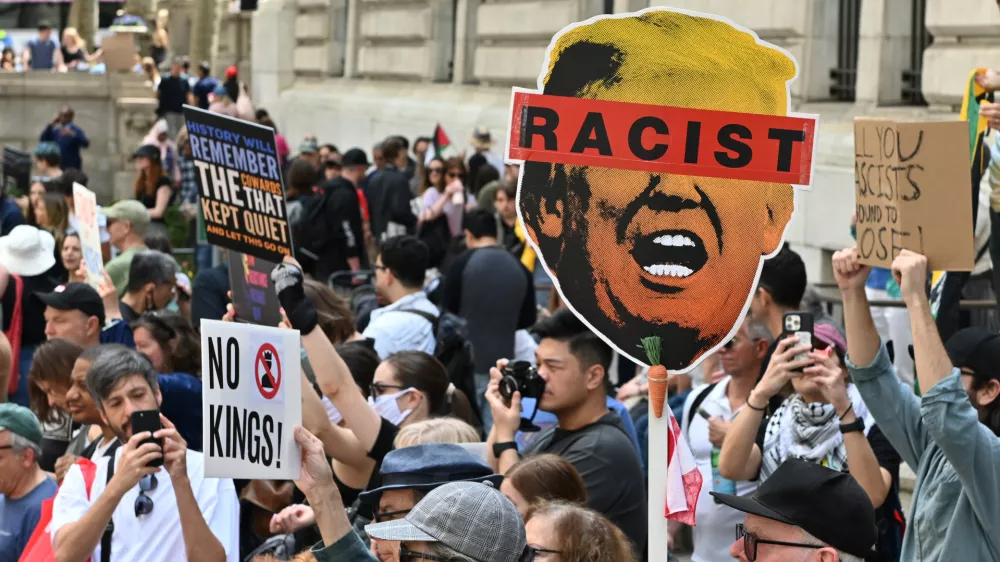 19 April 2025, US, New York: Protesters march through Midtown Manhattan to demonstrate against the Trump administration's policies on government, climate change, tariffs, immigration, and education. The organization 50501 places particular focus on condemning the administration's stance on immigration during the demonstration. Photo: Andrea Renault/ZUMA Press Wire/dpa