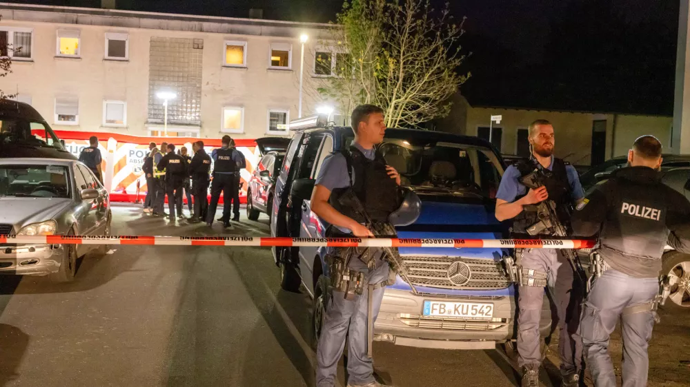 Police officers investigate the scene of a shooting in Bad Nauheim, Germany, Saturday, April 19, 2025. (Helmut Fricke/dpa via AP)