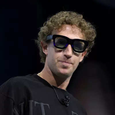 Meta CEO Mark Zuckerberg tries on Orion AR glasses at the Meta Connect annual event at the company's headquarters in Menlo Park, California, U.S., September 25, 2024. REUTERS/Manuel Orbegozo  TPX IMAGES OF THE DAY