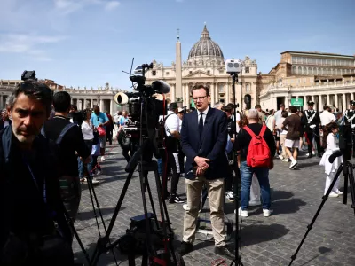 Members of the media gather outside St. Peter's Square, after the death of Pope Francis was announced by the Vatican, in Rome, Italy April 21, 2025. REUTERS/Yara Nardi