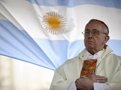 FILE - In this Aug. 7, 2009 file photo, Argentina's Cardinal Jorge Bergoglio gives a Mass outside the San Cayetano church where an Argentine flag hangs behind in Buenos Aires, Argentina. (AP Photo/Natacha Pisarenko, file)