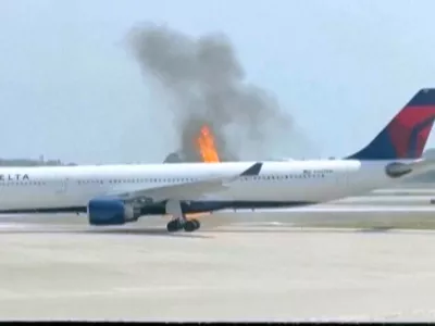 Flames rise from a Delta Air Lines airplane Monday, April 21, 2025, at the Orlando International Airport, in Orlando, Fla. (Dylan Wallace via AP)