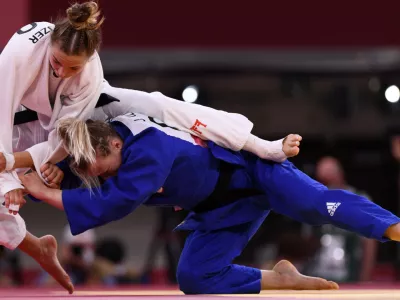 ﻿Tokyo 2020 Olympics - Judo - Women's 57kg - Bronze medal match - Nippon Budokan - Tokyo, Japan - July 26, 2021. Kaja Kajzer of Slovenia in action against Jessica Klimkait of Canada REUTERS/Annegret Hilse