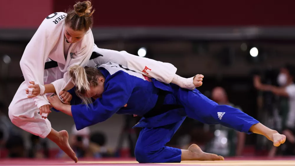 ﻿Tokyo 2020 Olympics - Judo - Women's 57kg - Bronze medal match - Nippon Budokan - Tokyo, Japan - July 26, 2021. Kaja Kajzer of Slovenia in action against Jessica Klimkait of Canada REUTERS/Annegret Hilse