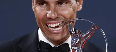 Laureus World Sports Awards - Palacio de Cibeles, Madrid, Spain - April 21, 2025 Spain former tennis player Rafael Nadal bites the sporting icon award after the ceremony REUTERS/Juan Medina