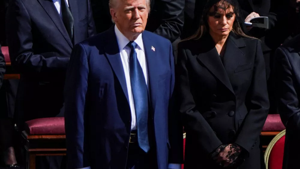 U.S President Donald Trump and first lady Melania Trump attend the funeral Mass of Pope Francis in St. Peter's Square at the Vatican, April 26, 2025. REUTERS/Nathan Howard