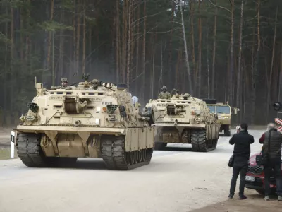 U.S. Army military vehicles including two M88 Recovery vehicles roll to attend recovery efforts continue for a missed U.S. Army soldier, as three other found dead on Monday, at a training range in Pabrade, north of Vilnius, Lithuania, Tuesday, April 1, 2025. (AP Photo/Mindaugas Kulbis)