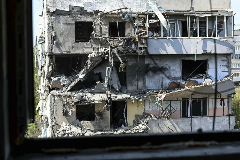 A multi-storey building is seen damaged by a Russian strike on residential neighbourhood in Zaporizhzhia, Ukraine, on Tuesday, April 22, 2025. (AP Photo/Kateryna Klochko)