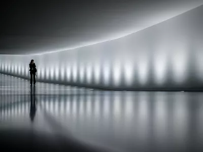 20 February 2025, Berlin: A Bundestag staff member walks through the connecting tunnel between the Reichstag building and Paul Loebe House, a passage frequently used by numerous MPs during parliamentary session weeks. The scene takes place ahead of the German Bundestag elections scheduled for February 23, 2025. Photo: Kay Nietfeld/dpa