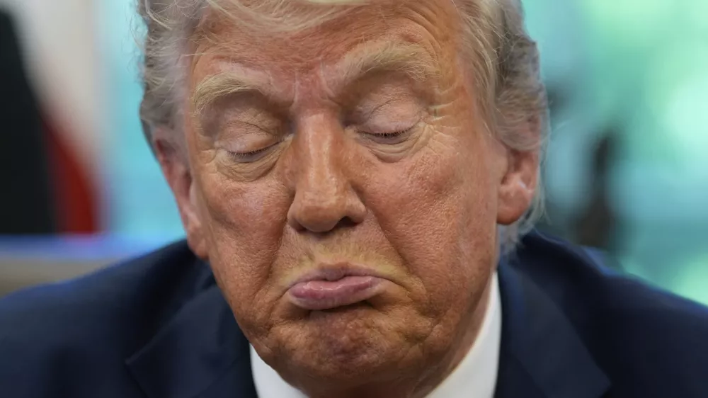 President Donald Trump speaks with reporters after signing executive orders in the Oval Office of the White House, Wednesday, April 23, 2025, in Washington. (AP Photo/Alex Brandon)