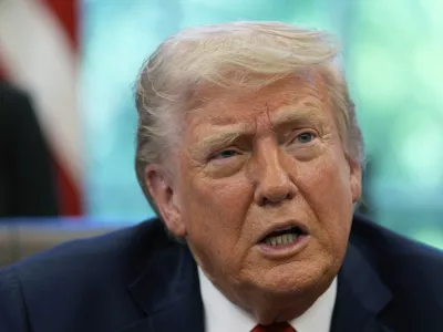 President Donald Trump speaks with reporters after signing executive orders in the Oval Office of the White House, Wednesday, April 23, 2025, in Washington. (AP Photo/Alex Brandon)