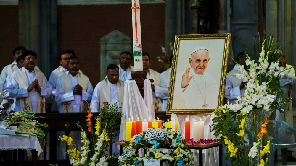 Christians attend a service for the late Pope Francis at the Sacred Heart Cathedral Church, in Lahore, Pakistan Thursday, April 24, 2025. (AP Photo/K.M. Chaudary)