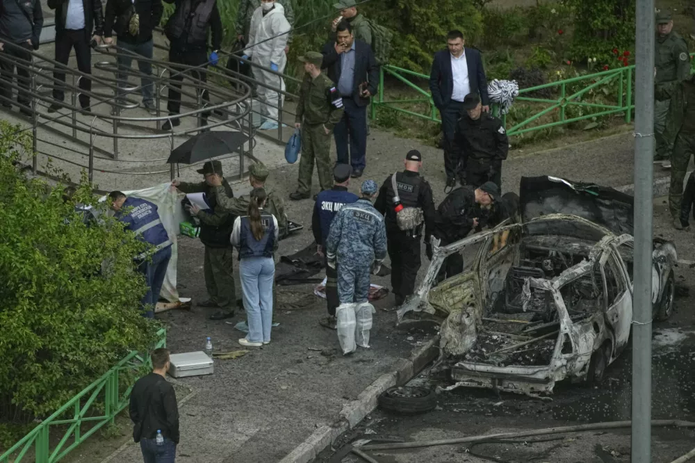 Investigators work at the scene where Lt. Gen. Yaroslav Moskalik, a deputy head of the main operational department in the General Staff of the Russian armed forces, was killed by an explosive device placed in his car in Balashikha, just outside Moscow, Russia, on Friday, April 25, 2025. (AP Photo)