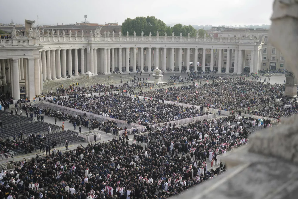Clergy and the faithful arrive ahead of the funeral of Pope Francis in St. Peter's Square at the Vatican, Saturday, April 26, 2025. (AP Photo/Markus Schreiber)