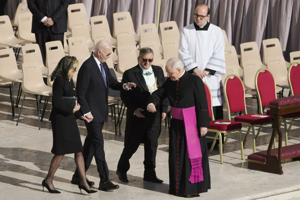 Former U.S. President Joe Biden, second left, and his wife Jill arrive for the funeral of Pope Francis in St. Peter's Square at the Vatican, Saturday, April 26, 2025. (AP Photo/Markus Schreiber)