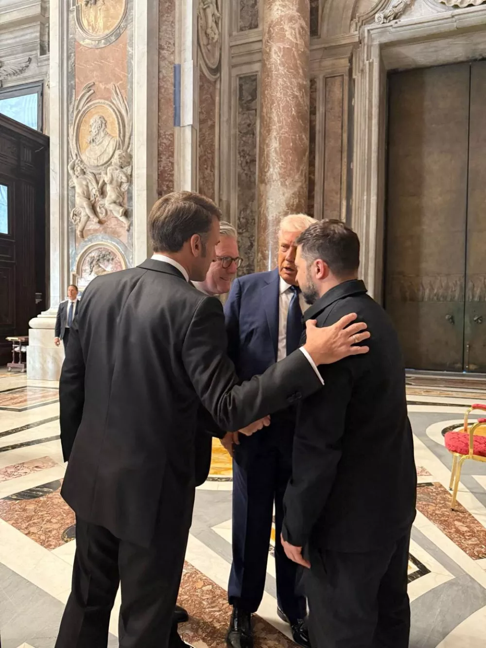 Ukraine's President Volodymyr Zelenskiy, U.S. President Donald Trump, French President Emmanuel Macron and British Prime Minister Keir Starmer appear at a meeting, while they attend the funeral of Pope Francis, in St Peter's Basilica, at the Vatican, Italy April 26, 2025. Ukrainian Presidential Press Service/Handout via REUTERS  THIS IMAGE HAS BEEN SUPPLIED BY A THIRD PARTY