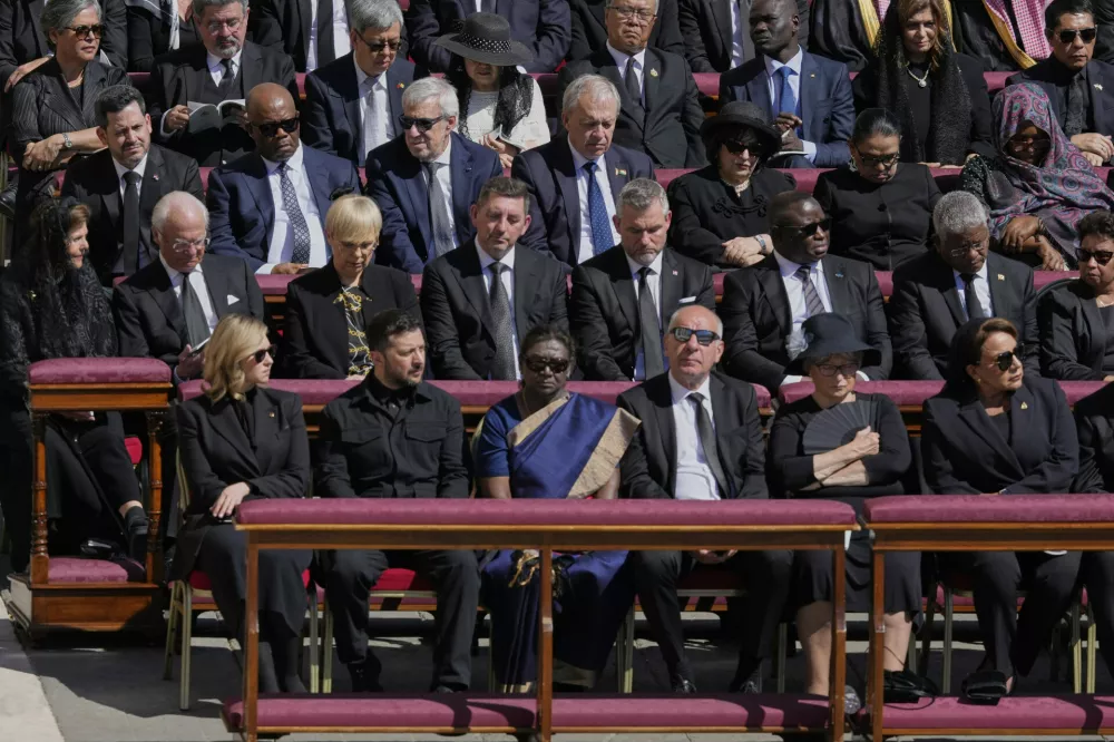 Ukraine's President Volodymr Zelenskyy, front row second from left, and Ukraine's first lady Olena Zelenska are seem amongst other dignitaries during the funeral of Pope Francis in St. Peter's Square at the Vatican, Saturday, April 26, 2025. (AP Photo/Gregorio Borgia)