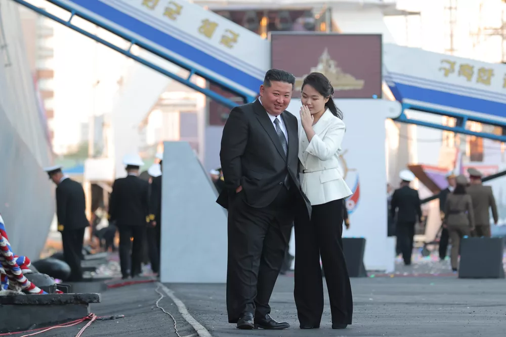 HANDOUT - 26 April 2025, North Korea, Nampho: A photo released by the North Korean State News Agency (KCNA) on 26 April 2025 shows leader Kim Jong-un (L) and his daughter, Ju-ae, attending a launching ceremony for a new navy destroyer at a shipyard in the western port city of Nampho. Photo: -/kcna/dpa - ATTENTION: editorial use only and only if the credit mentioned above is referenced in full
