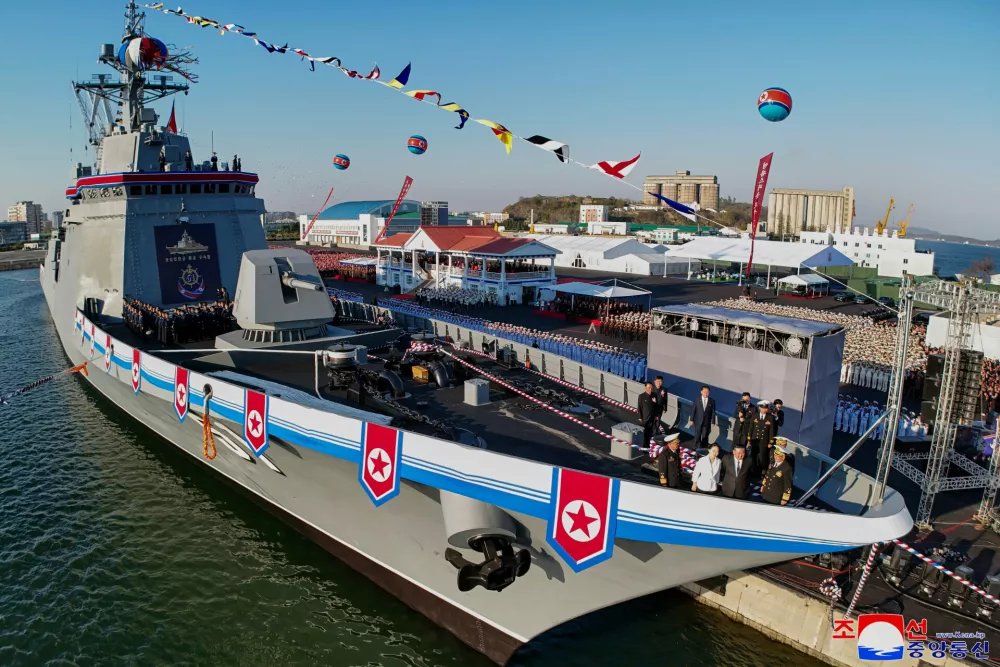 In this photo provided by the North Korean government, its leader Kim Jong Un, second right, and his daughter, third right, seen at bottom right, attend a ceremony to unveil a new naval destroyer at a western port in Nampo a launching ceremony at a western port in Nampo, North Korea, Friday, April 25, 2025. Independent journalists were not given access to cover the event depicted in this image distributed by the North Korean government. The content of this image is as provided and cannot be independently verified. Korean language watermark on image as provided by source reads: "KCNA" which is the abbreviation for Korean Central News Agency. (Korean Central News Agency/Korea News Service via AP)