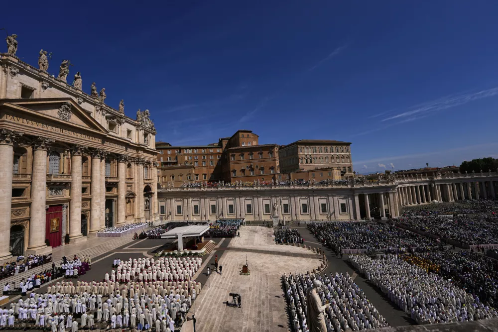 People attend a mass presided over by Vatican Secretary of State, Cardinal Pietro Parolin on the second of nine days of mourning for late Pope Francis in St. Peter's Square, at the Vatican, Sunday, April 27, 2025. (AP Photo/Andreea Alexandru)