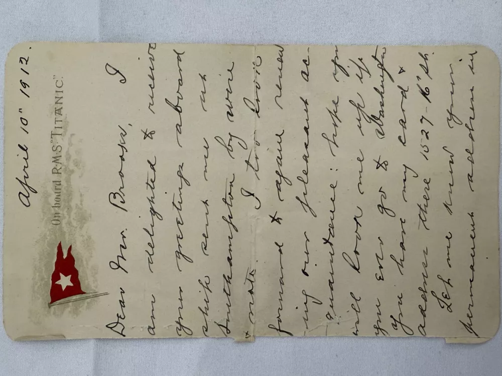 This undated handout picture provided by the auctioneers Henry Aldridge & Son, England, shows a lettercard, penned by one of the Titanic's most well-known survivors from onboard the ship days before it sank, which has sold for 300,000 pounds ($399,000) at auction. (Henry Aldridge & Son via AP)